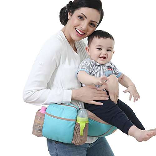 Woman holding a baby using a baby carrier with a bag attached.