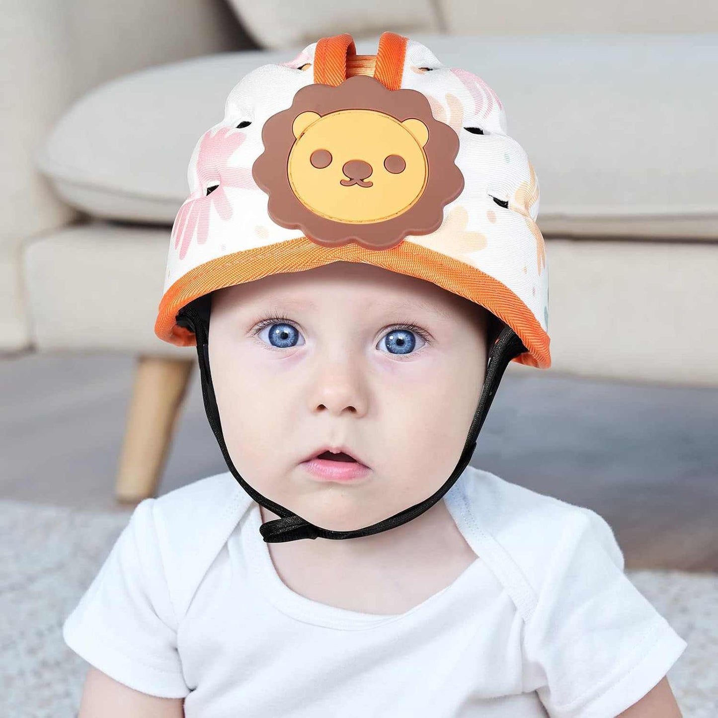Baby wearing a lion-themed helmet indoors