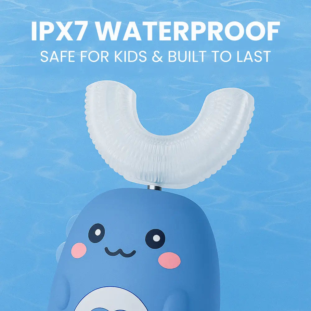 Blue toy whale with white top on a blue water background, featuring text about waterproof rating. SWEVVA DinoBrush 360° U-Shaped Kids Electric Toothbrush