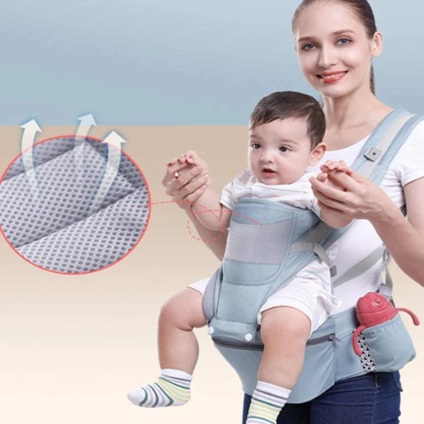 Woman holding a baby in a baby carrier with a close-up of the carrier's padding.
