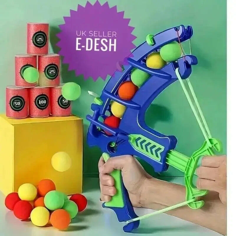 Colorful toy bow and arrow set with multicolored balls on a green background, featuring 'UK Seller E-Desh' branding.