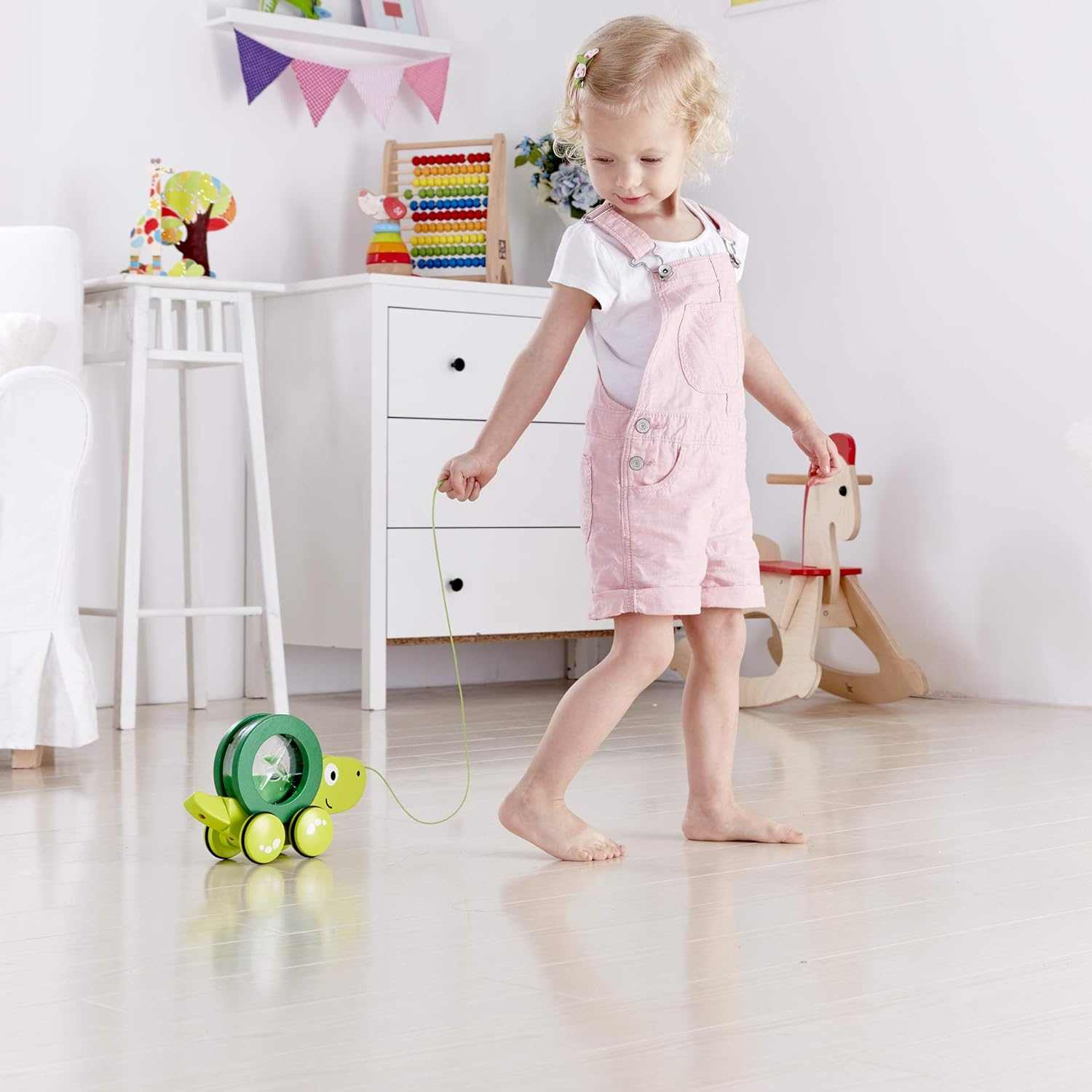 Colorful wooden pull along toys for toddlers with animal designs promoting early walking and sensory play