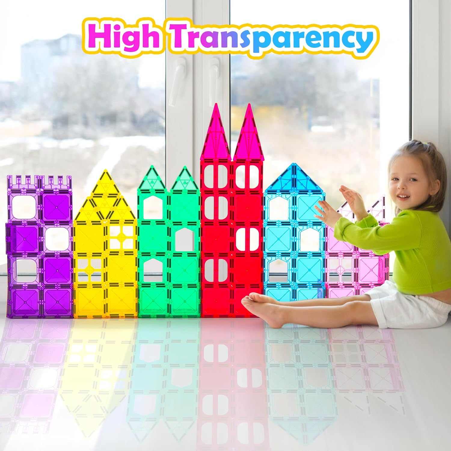 Colorful transparent building block toys on a table with a child interacting with them, labeled 'High Transparency'.