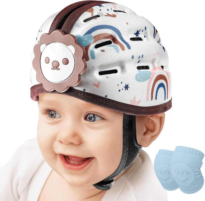 Baby wearing a colorful helmet with a lion design, smiling on a white background.