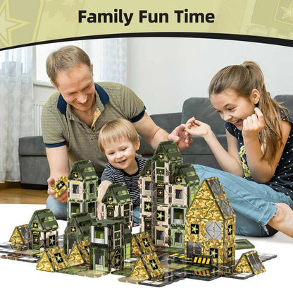 Family playing with a model building set on a table, with a neutral background.