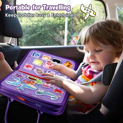 Child playing with a portable educational toy in a car