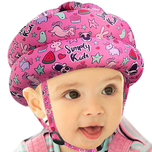 Baby wearing pink patterned baby safety helmet with 360° head protection for infants