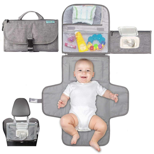 Gray portable baby changing pad with wipes pocket, mesh compartments, foldable design, and baby lying on it