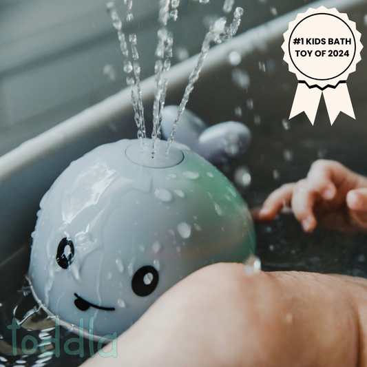 Children's bath toy shaped like a whale with water sprays, labeled as #1 Kids Bath Toy of 2024.