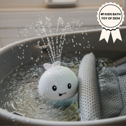 White bath toy with water sprayer in a bathtub, labeled as #1 Kids Bath Toy of 2025.