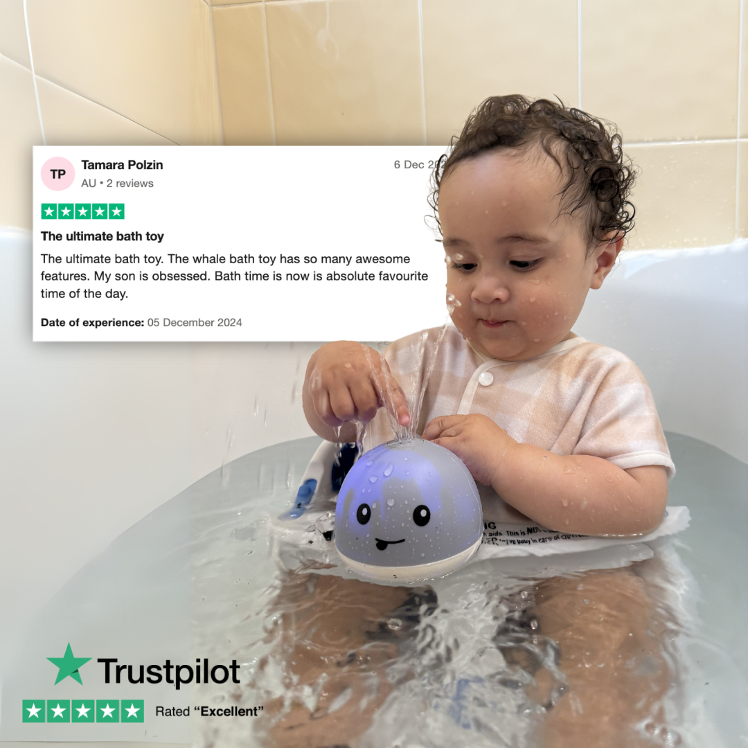 Child playing with a whale-shaped bath toy in a bathtub, with a Trustpilot review displayed above.