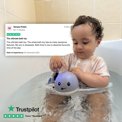 Child playing with a whale-shaped bath toy in a bathtub, with a Trustpilot review displayed above.