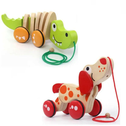 Wooden toy alligator and dog with pull strings on a white background