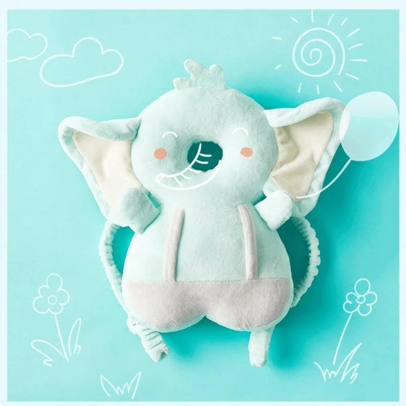 Plush elephant toy on a light blue background with minimalistic white line drawings.