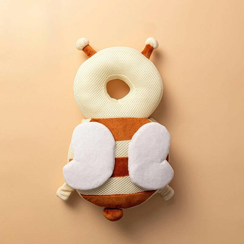 Plush toy with a striped body and white accents on a beige background