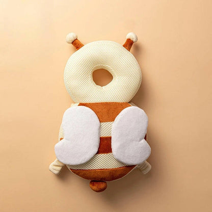 Plush toy with a striped body and white accents on a beige background